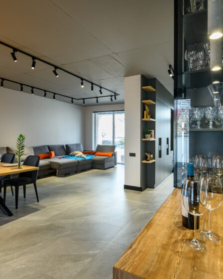 Modern luxury loft studio apartment interior with dining table in large living room